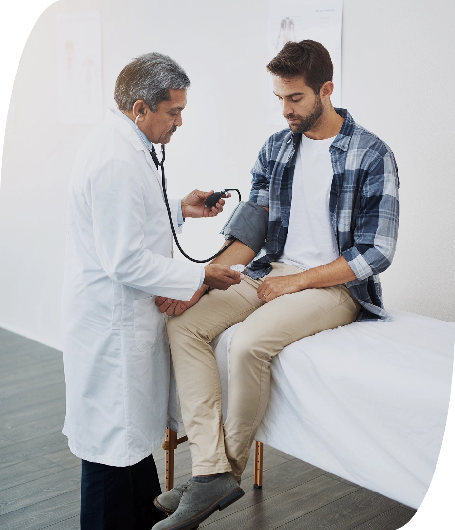 Male patient getting their blood pressure taken before men's health services are administered by orlando doctors