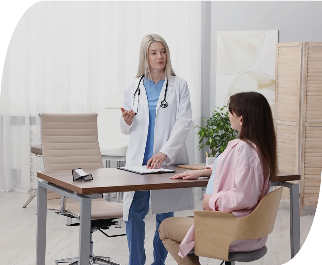 Doctor going over women's health treatment plans with patient