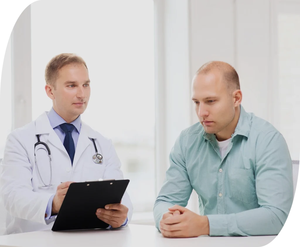 Doctor speaking with male patient for men's health services appointment