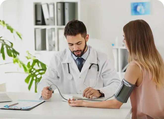 Doctor taking the blood pressure of a patient