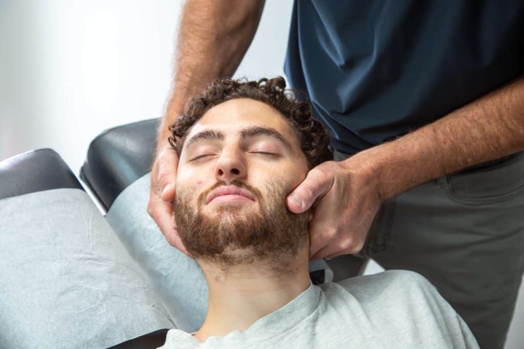Patient receiving chiropractic care for patient resources
