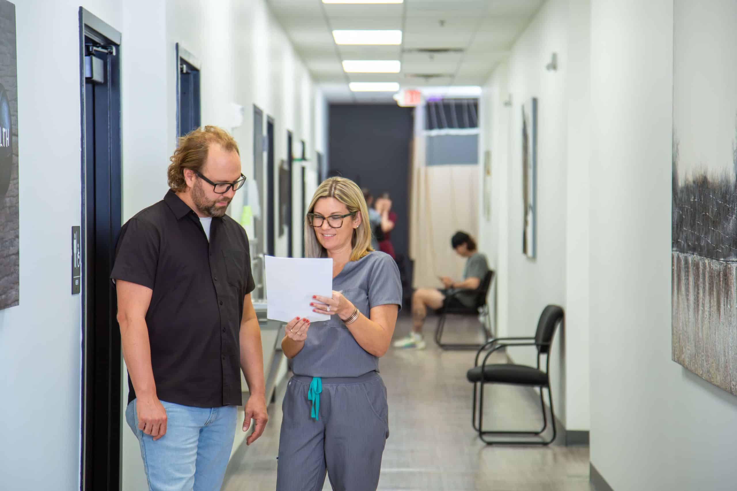 Chiropractic Doctor going over chiropractic treatment plan with patient