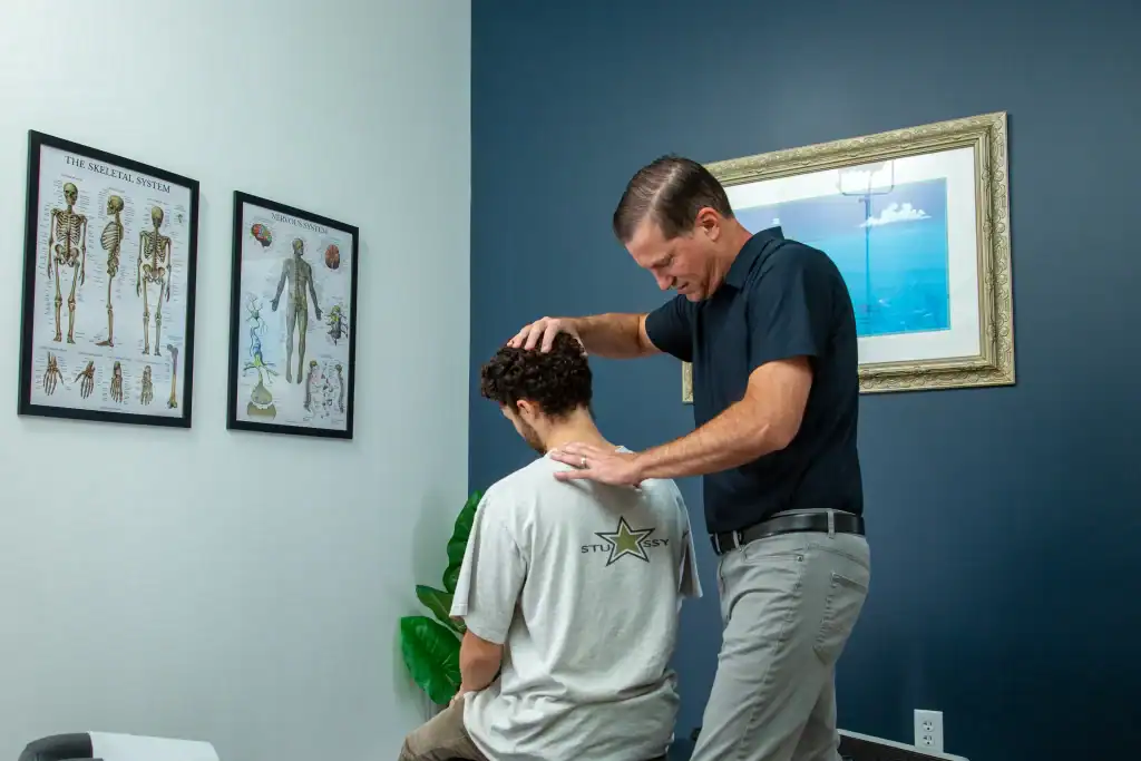 Dr. Pavlik working on patient with neck pain in orlando