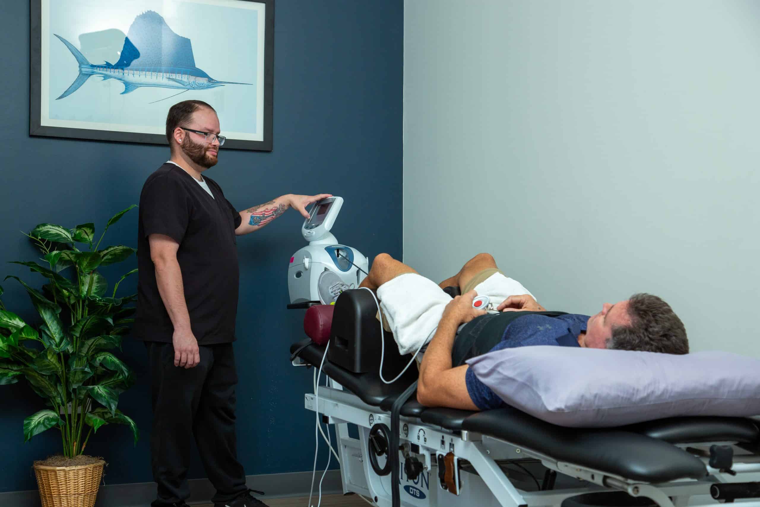 Patient getting spinal decompression therapy for sciatica pain relief in Orlando